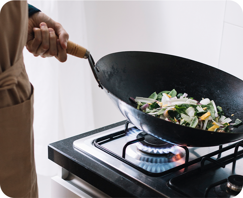 Wok auf dem Gasherd